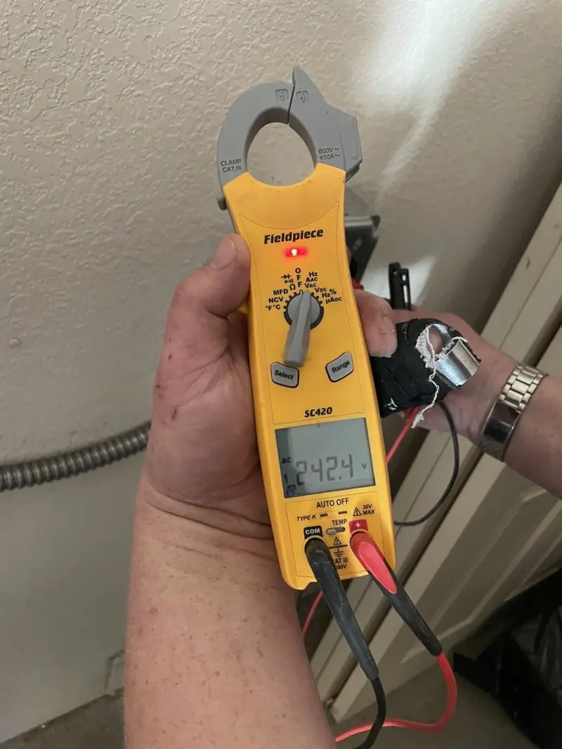 Voltage testing with clamp meter during Electrical Installation Services in Canterbury